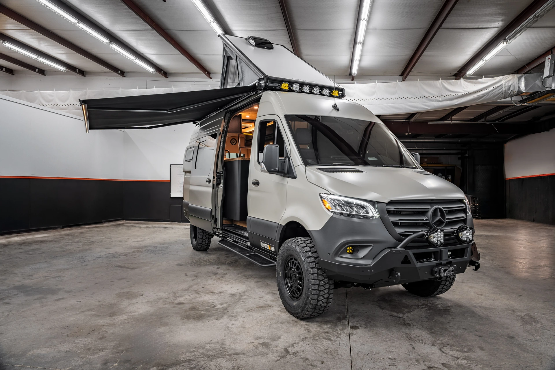 OmegaVan with roof tent and awning deployed